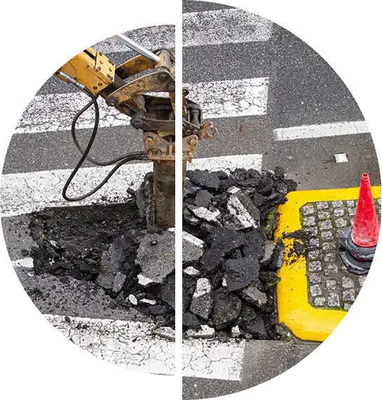 Jackhammer breaking out a patch of damaged pavement