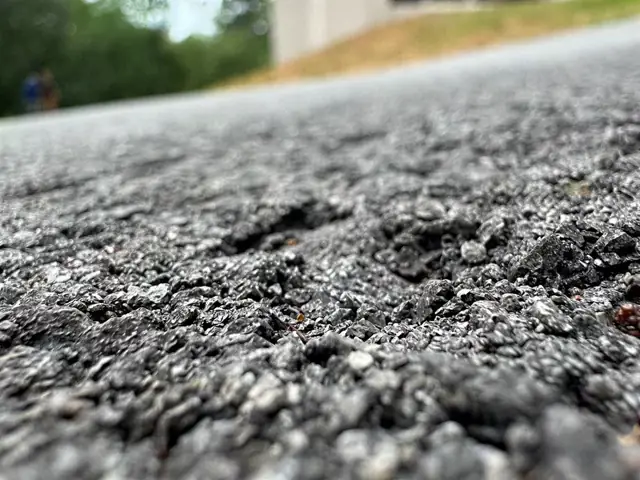 Close-up of loose stone on a chip-sealed surface